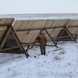 Fritz beside some portable shelters